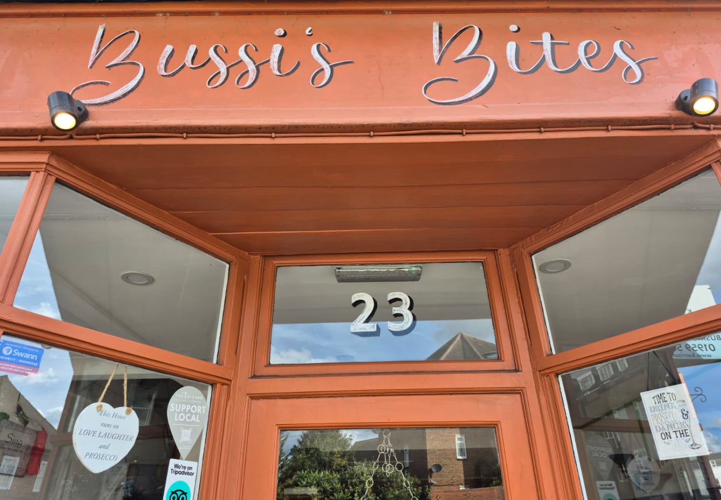 Bussi's Restaurant door front showing number 23